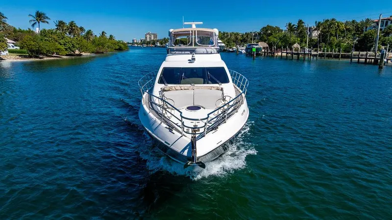 All In Yacht Photos Pics 2010 Azimut 62 Evolution Fly yacht cruising on a scenic waterway.