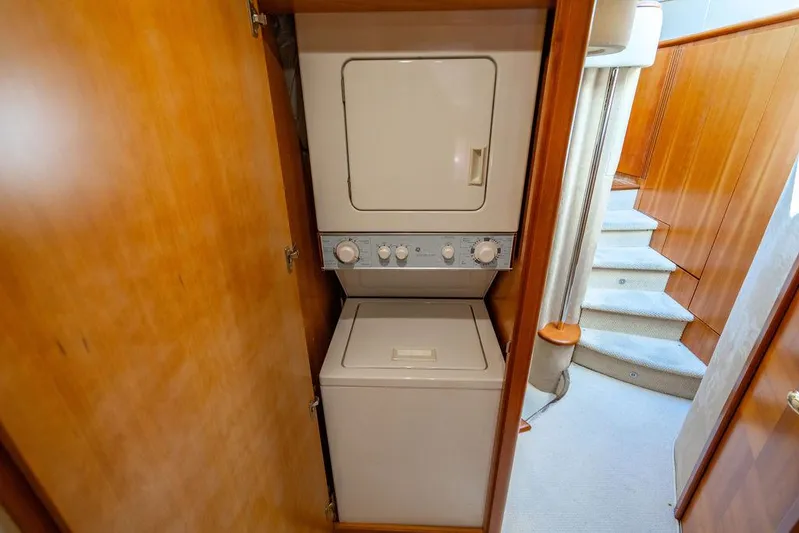 All In Yacht Photos Pics Stacked washer and dryer in 2010 Azimut 62 Evolution Fly yacht interior.