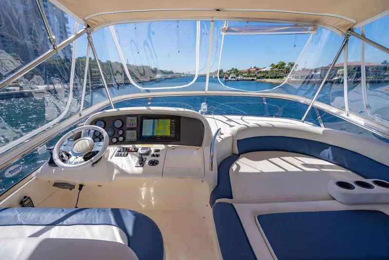 All In Yacht Photos Pics Helm of 2010 Azimut 62 Evolution Fly yacht with navigation controls and seating.