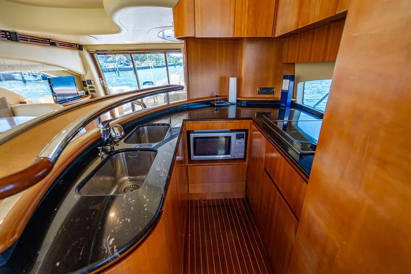 All In Yacht Photos Pics Luxurious kitchen interior of 2010 Azimut 62 Evolution Fly yacht with modern amenities.