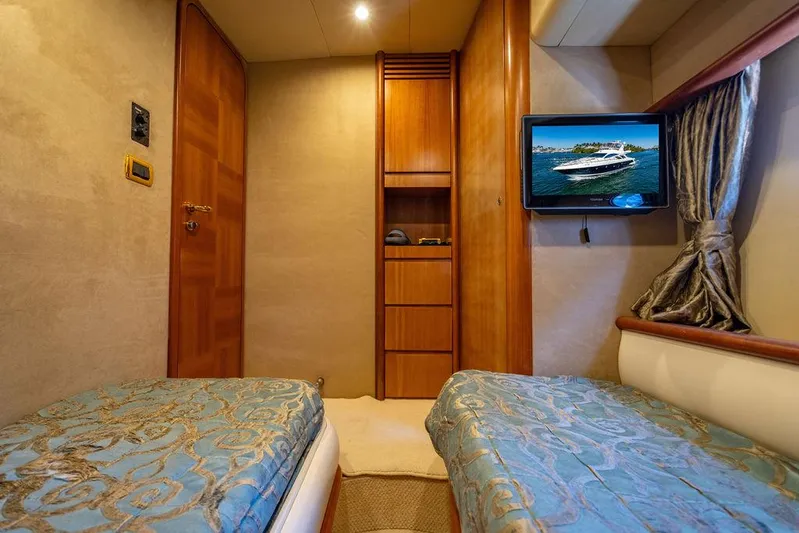 All In Yacht Photos Pics Luxurious cabin interior of 2010 Azimut 62 Evolution Fly yacht with twin beds and TV.