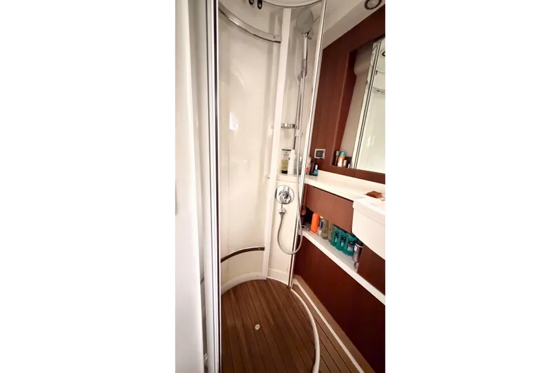  Yacht Photos Pics Luxurious bathroom in 2011 Princess 54 yacht with modern shower and wooden flooring.