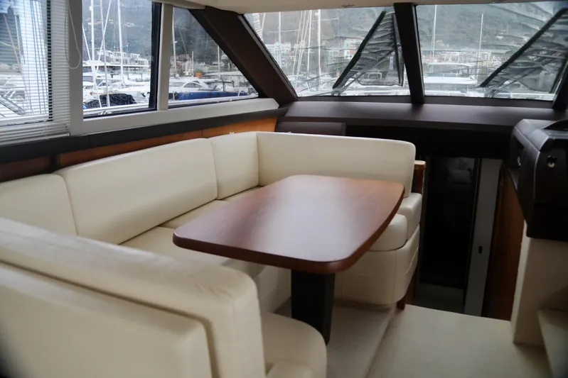  Yacht Photos Pics Luxurious interior of 2011 Princess 54 yacht with elegant seating and wooden table.