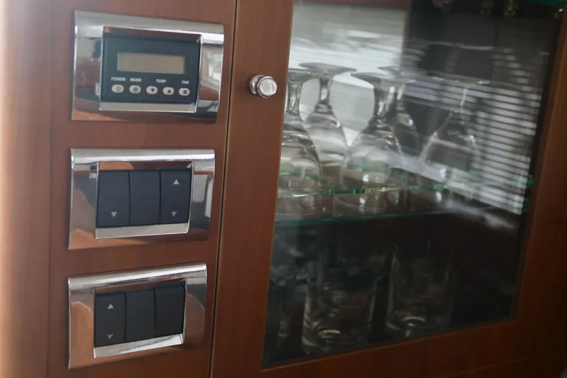  Yacht Photos Pics Control panel and glass cabinet in 2011 Princess 54 yacht interior.