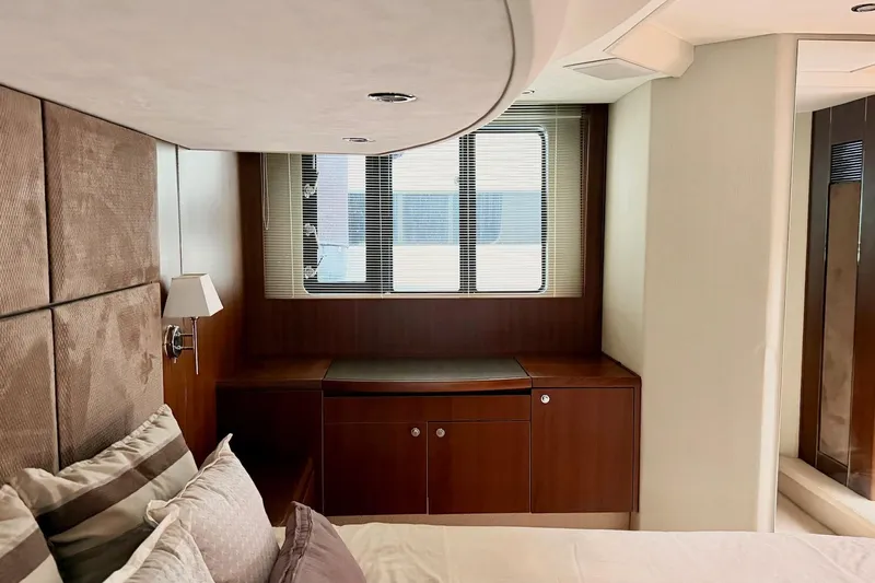 Yacht Photos Pics Luxurious cabin interior of 2011 Princess 54 yacht with elegant wood finish.