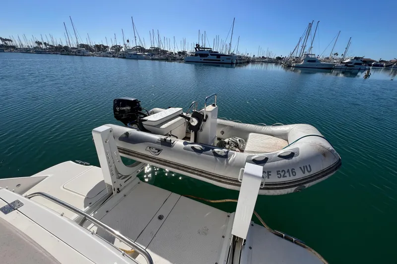  Yacht Photos Pics Inflatable dinghy on a 2013 Meridian 441 Sedan yacht in a marina.