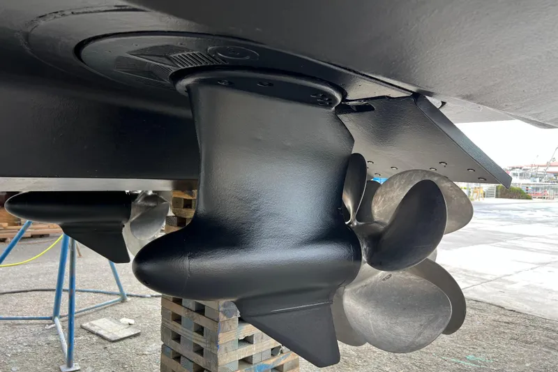  Yacht Photos Pics Close-up of 2013 Meridian 441 Sedan boat propeller and rudder system.