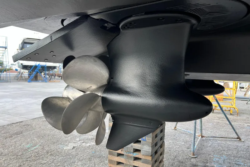  Yacht Photos Pics Close-up of 2013 Meridian 441 Sedan boat propeller in a shipyard.