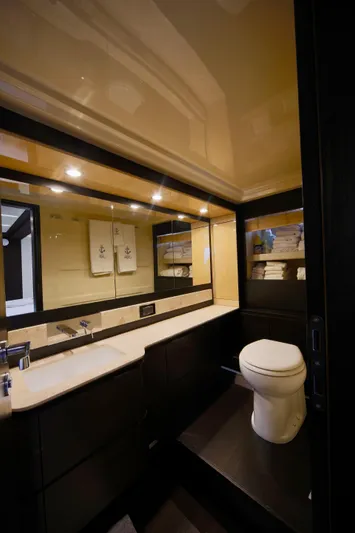 Kiki Yacht Photos Pics Luxurious bathroom in 2016 Azimut 66 yacht with modern fixtures and elegant design.