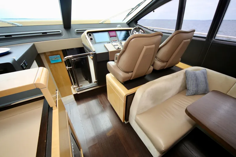 Kiki Yacht Photos Pics Interior of 2016 Azimut 66 yacht with helm, seating, and modern design.