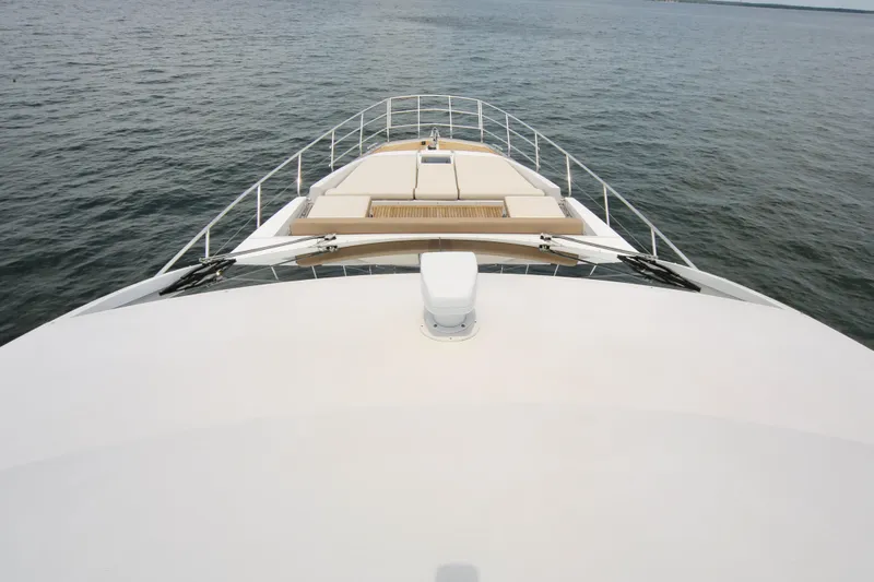 Kiki Yacht Photos Pics Bow view of 2016 Azimut 66 yacht on calm water.