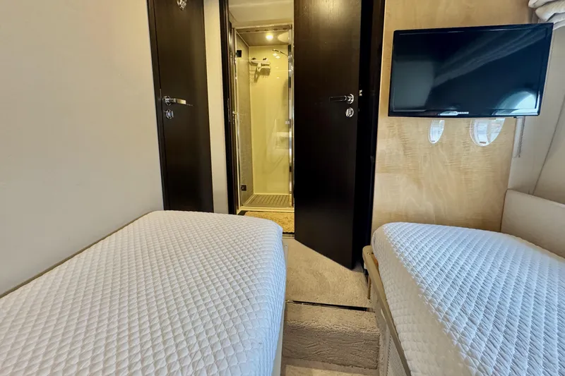 Kiki Yacht Photos Pics Luxurious 2016 Azimut 66 yacht cabin with twin beds and modern amenities.