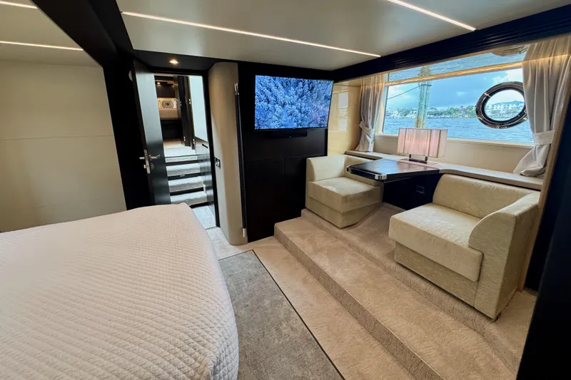 Kiki Yacht Photos Pics Luxurious interior of 2016 Azimut 66 yacht with cozy seating and scenic window view.