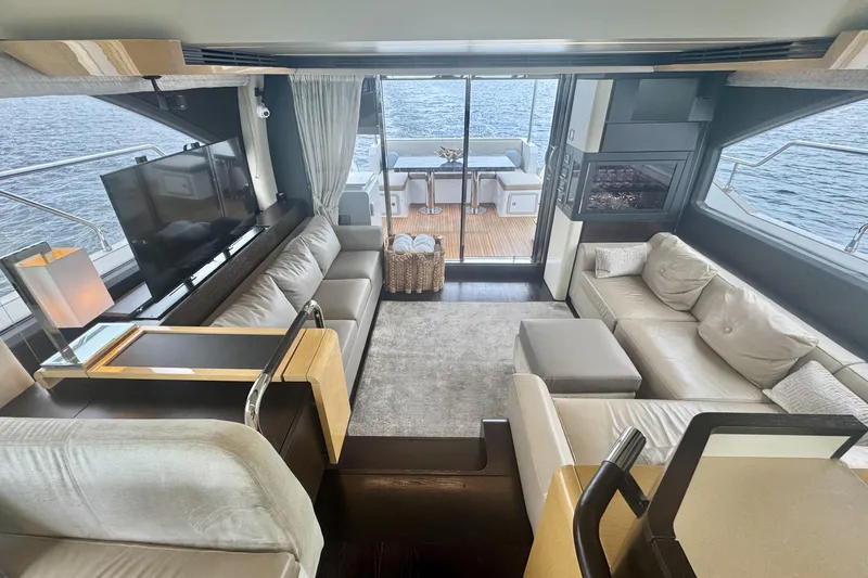 Kiki Yacht Photos Pics Luxurious interior of a 2016 Azimut 66 yacht with elegant seating and ocean view.