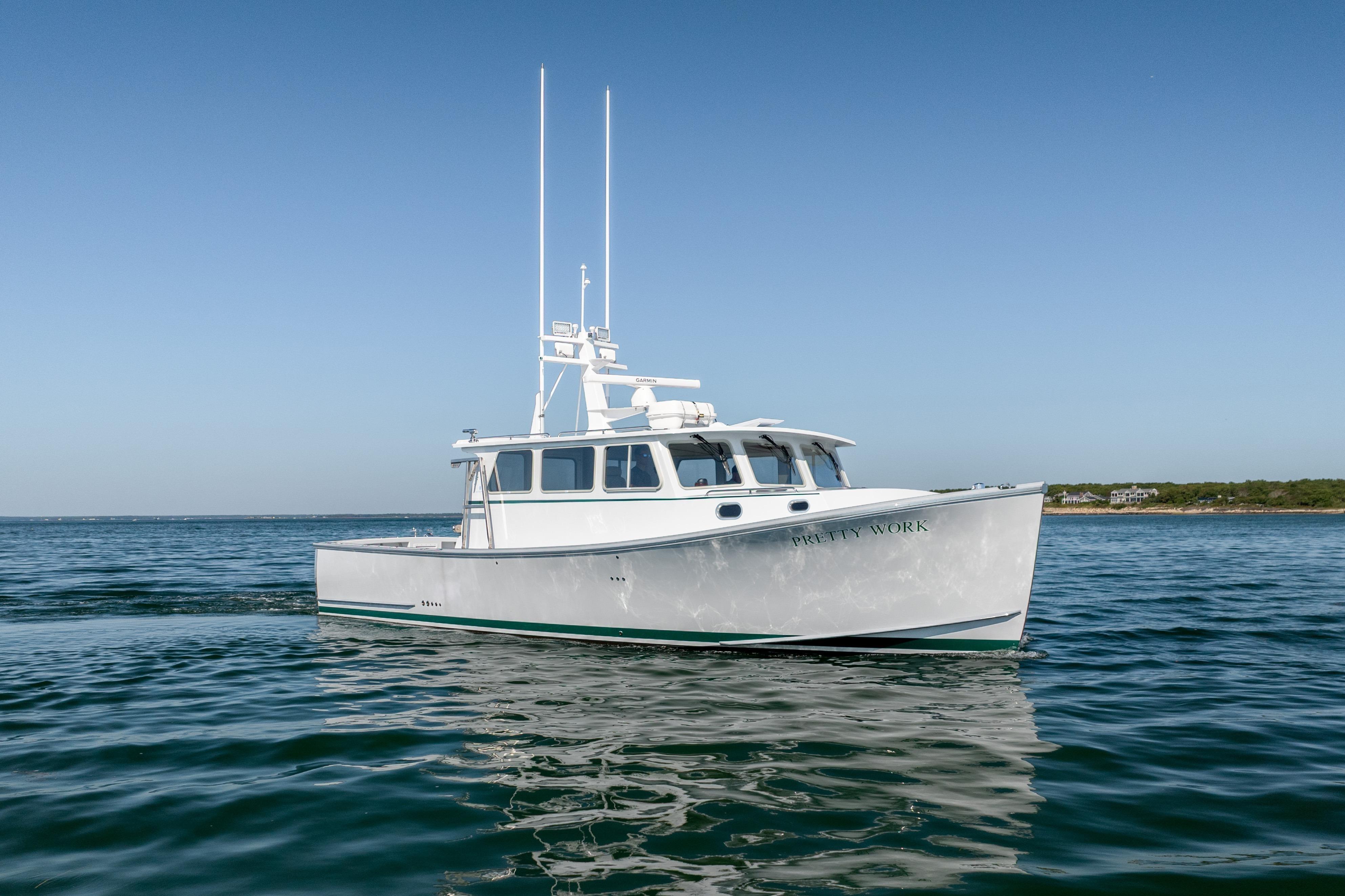 2025 Mussel Ridge 42 boat on calm ocean waters under clear blue sky.