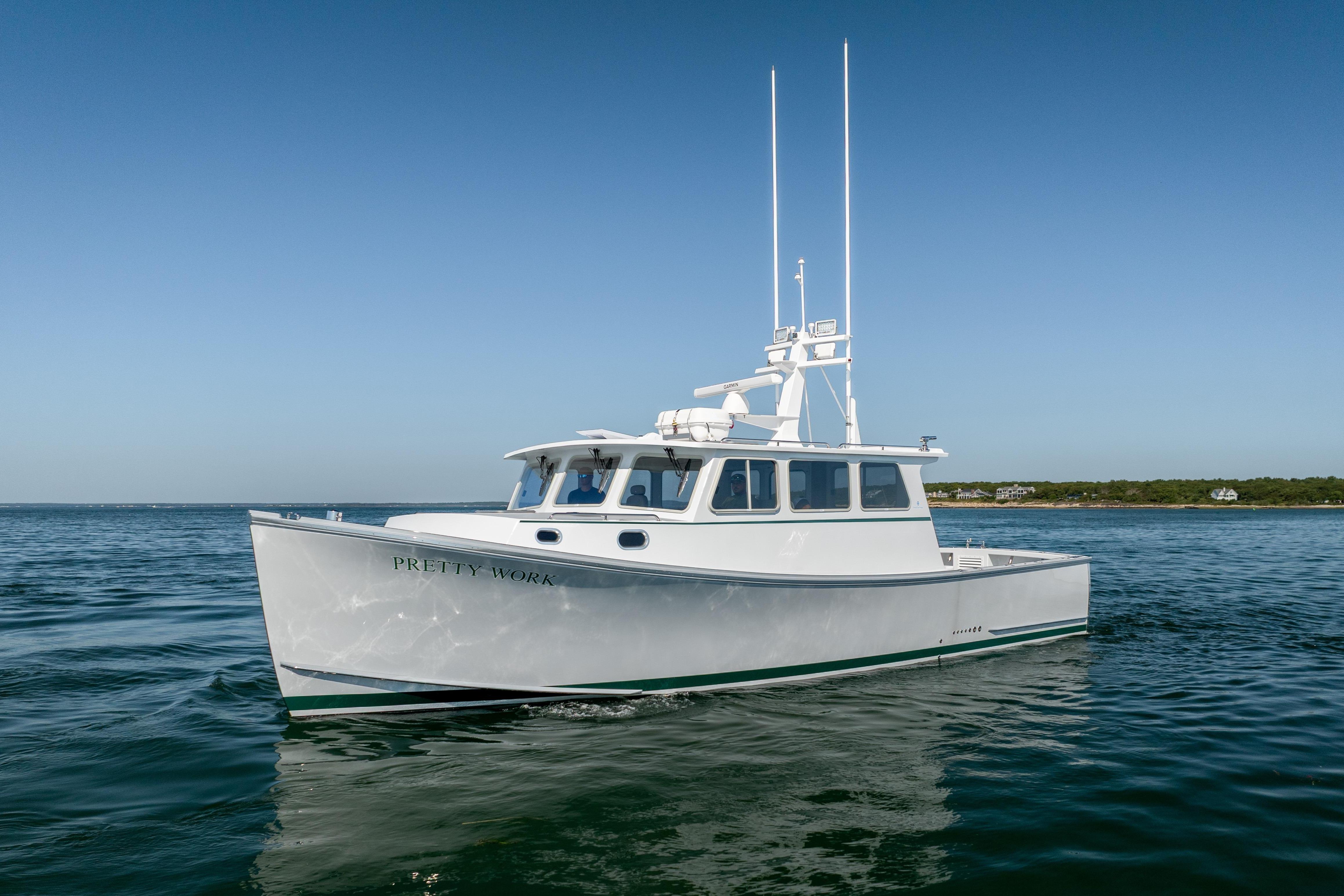 2025 Mussel Ridge 42 boat on calm water under clear blue sky.