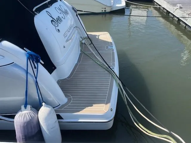 Yacht Photos Pics 2005 Formula 34PC boat docked with fenders and ropes, rear view.