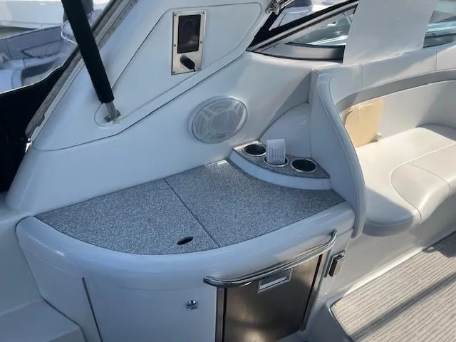  Yacht Photos Pics 2005 Formula 34PC boat interior with seating, countertop, and cup holders.