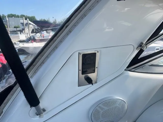  Yacht Photos Pics Interior view of a 2005 Formula 34PC boat, featuring a control panel and speaker.