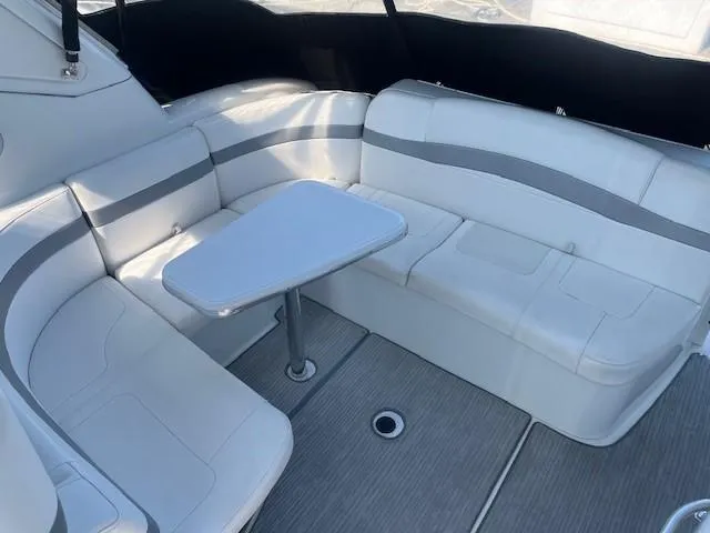  Yacht Photos Pics 2005 Formula 34PC boat interior with white seating and table.