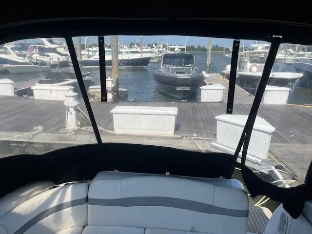  Yacht Photos Pics 2005 Formula 34PC boat interior view at marina with docked boats.