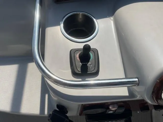  Yacht Photos Pics Control panel of a 2005 Formula 34PC boat with joystick and cup holder.