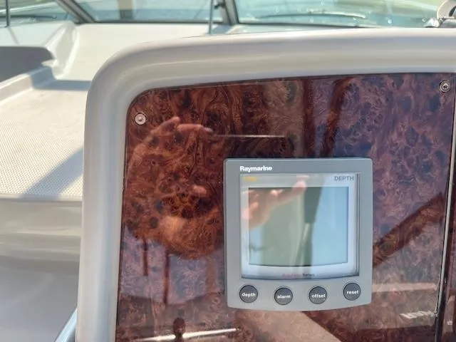  Yacht Photos Pics Raymarine depth gauge on 2005 Formula 34PC boat dashboard with wood finish.