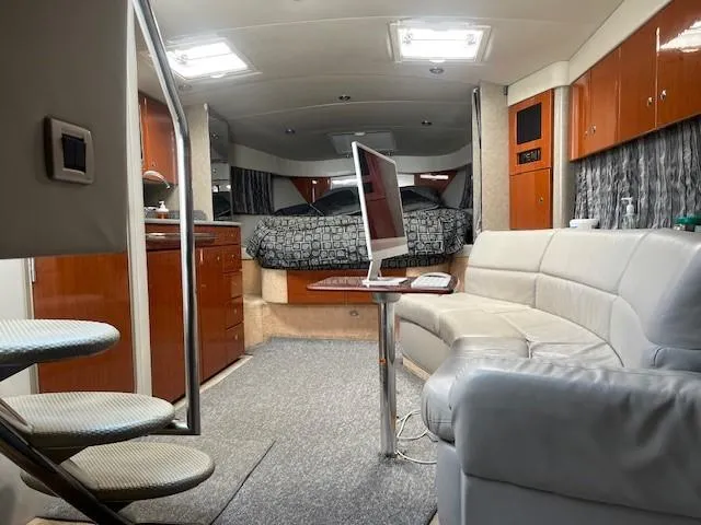  Yacht Photos Pics Interior of a 2005 Formula 34PC yacht with modern furnishings and cozy seating area.