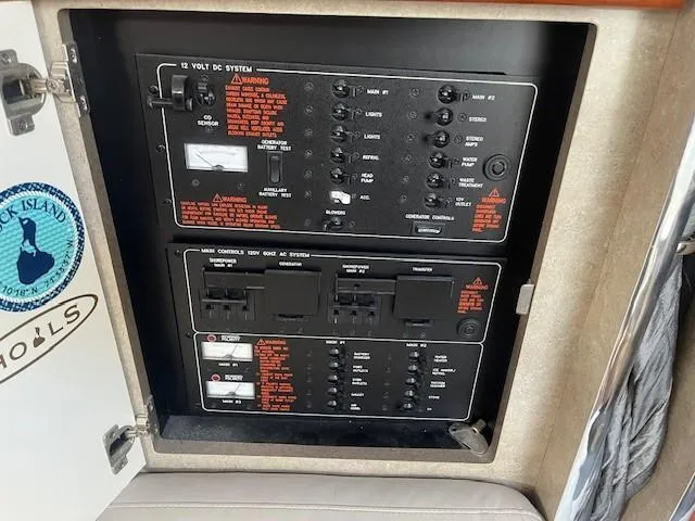  Yacht Photos Pics Electrical control panel on a 2005 Formula 34PC boat, featuring various switches and indicators.