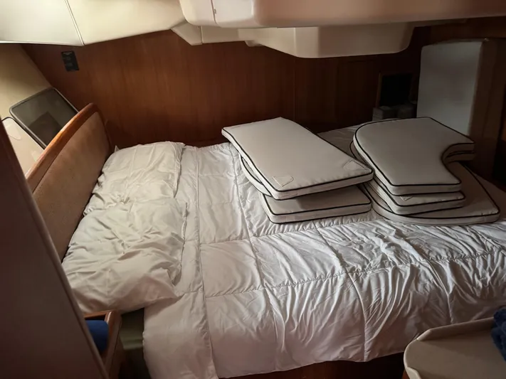 Strider Yacht Photos Pics Interior cabin of 2006 Hunter 41 Deck Salon with bed and cushions.
