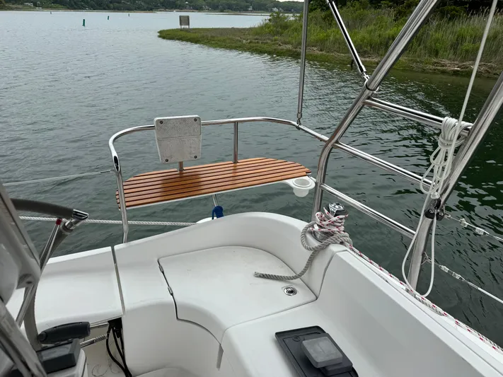 Strider Yacht Photos Pics 2006 Hunter 41 Deck Salon sailboat cockpit with water view and stainless steel railings.