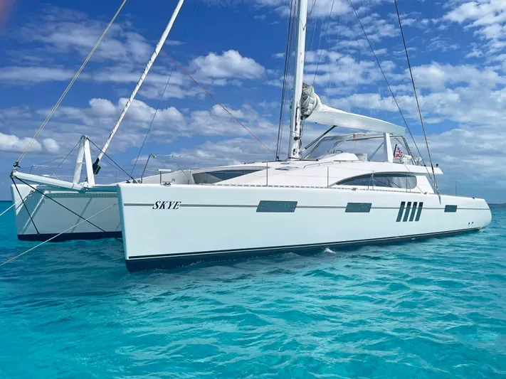 Skye Yacht Photos Pics Custom Mystique Yachts Silhouette 800, 2023 model, sailing on clear turquoise waters.