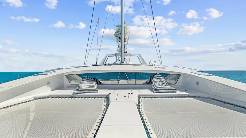 Skye Yacht Photos Pics Luxurious 2023 Mystique Yachts Silhouette 800 deck with ocean view and clear skies.