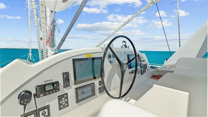 Skye Yacht Photos Pics 2023 Mystique Yachts Silhouette 800 helm with navigation controls and ocean view.