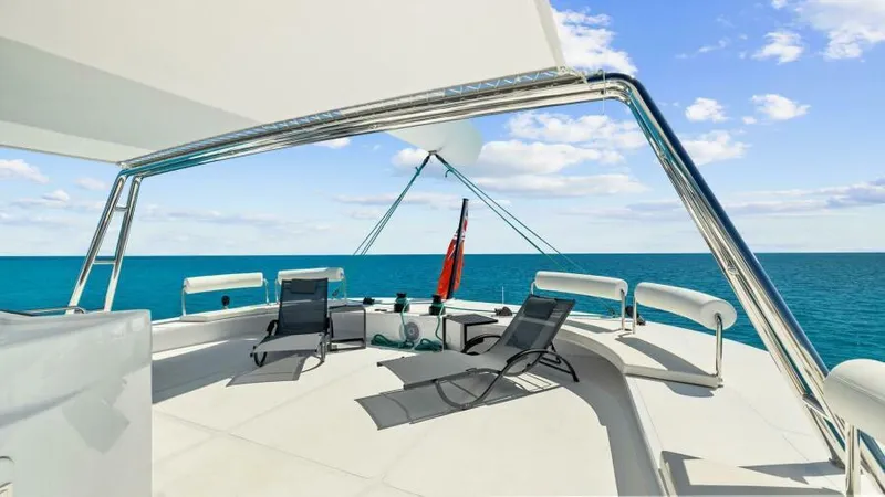 Skye Yacht Photos Pics Luxurious 2023 Mystique Yachts Silhouette 800 deck with lounge chairs and ocean view.