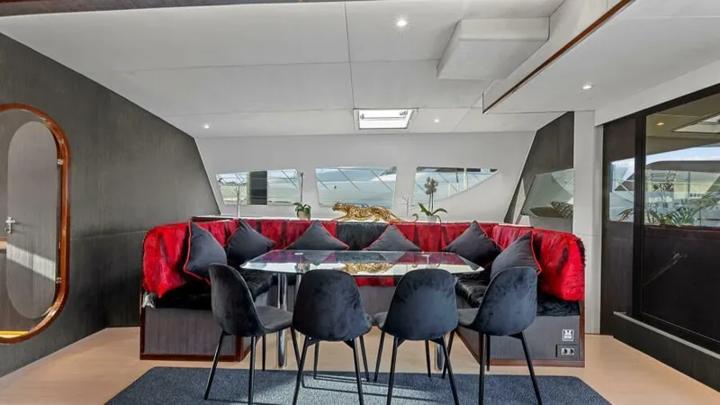 Skye Yacht Photos Pics Luxurious interior of 2023 Mystique Yachts Silhouette 800 with elegant dining area.
