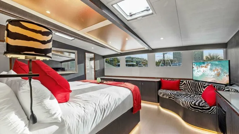 Skye Yacht Photos Pics Luxurious 2023 Mystique Yachts Silhouette 800 bedroom with modern decor and vibrant accents.
