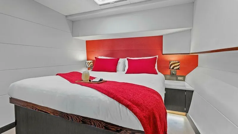 Skye Yacht Photos Pics Luxurious bedroom in 2023 Mystique Yachts Silhouette 800 with red accents and modern design.