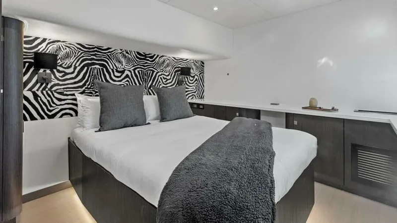 Skye Yacht Photos Pics Luxurious bedroom in 2023 Mystique Yachts Silhouette 800 with zebra-patterned decor.