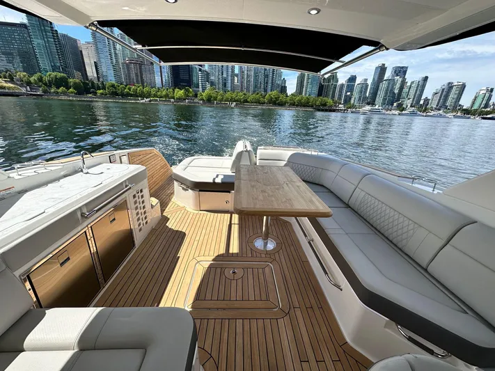 Aquaholic Yacht Photos Pics Luxurious 2023 Sea Ray SLX 400 yacht interior with city skyline view.