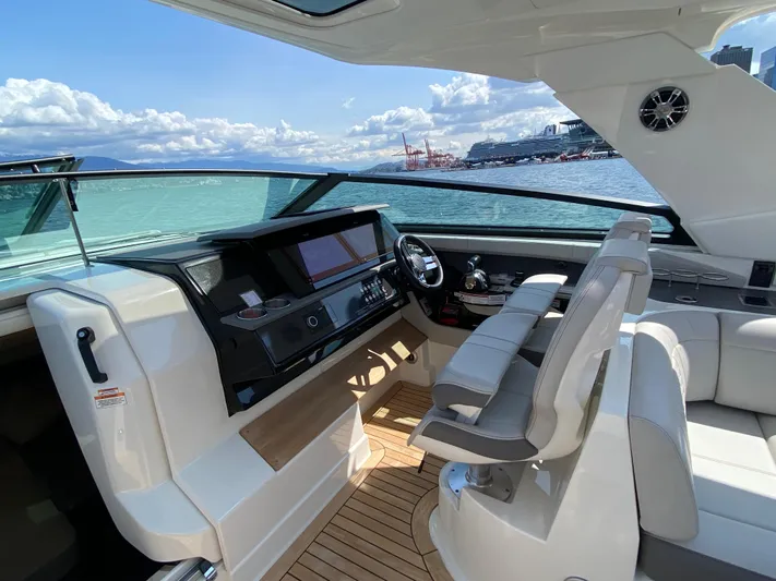 Aquaholic Yacht Photos Pics 2023 Sea Ray SLX 400 yacht interior with modern helm and seating, on a sunny day.