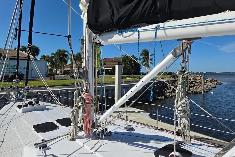 Cookie Monster Too Yacht Photos Pics 1982 Tayana Center Cockpit Cutter Ketch docked, showcasing rigging and deck details.