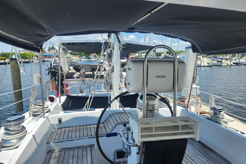Cookie Monster Too Yacht Photos Pics 1982 Tayana Center Cockpit Cutter Ketch with wooden deck, docked at marina.