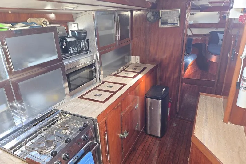 Cookie Monster Too Yacht Photos Pics Interior of 1982 Tayana Center Cockpit Cutter Ketch, featuring a well-equipped galley kitchen.