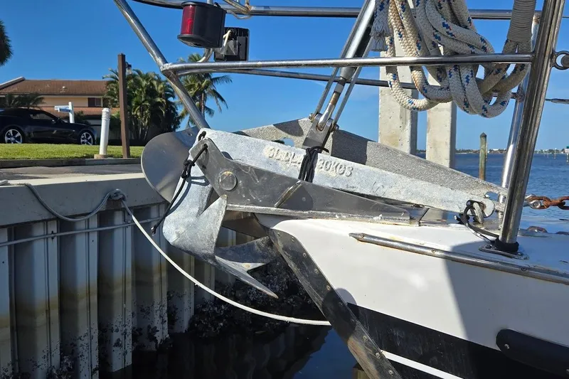 Cookie Monster Too Yacht Photos Pics 1982 Tayana Center Cockpit Cutter Ketch anchor detail at dockside, with ropes and clear sky.