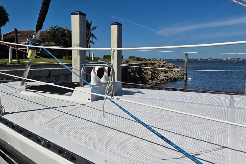 Cookie Monster Too Yacht Photos Pics 1982 Tayana Center Cockpit Cutter Ketch deck with ocean view and clear blue sky.