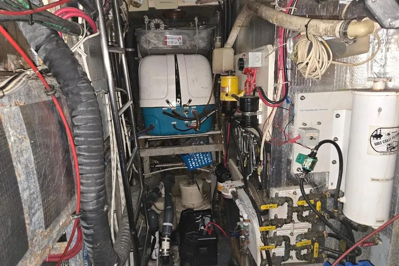 Cookie Monster Too Yacht Photos Pics Engine room of 1982 Tayana Center Cockpit Cutter Ketch with various mechanical components.