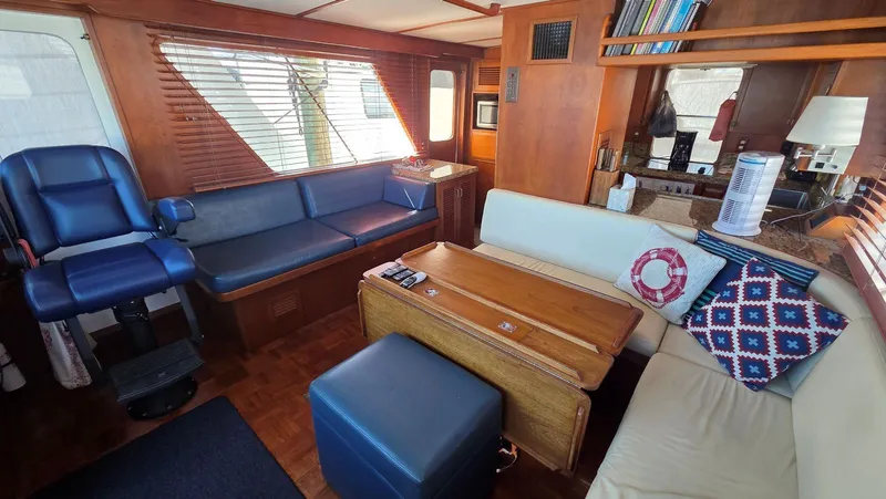 C U Later Yacht Photos Pics Interior of 1987 DeFever 48 Tri Cabin yacht, featuring cozy seating area.