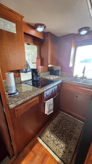 C U Later Yacht Photos Pics 1987 DeFever 48 Tri Cabin yacht kitchen interior.