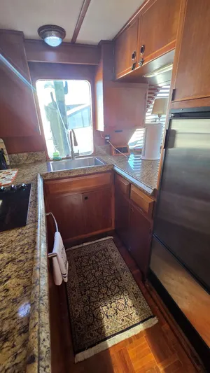 C U Later Yacht Photos Pics 1987 DeFever 48 Tri Cabin yacht kitchen interior.